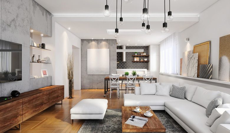 Sala de apartamento bem iluminada, com moveis de madeira e um belo sofá branco.